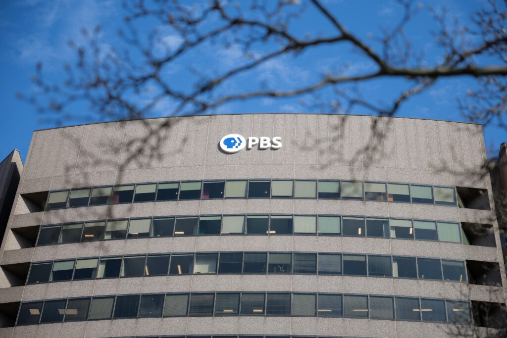 A sign for the Public Broadcasting Service, or PBS,  is seen on its building headquarters on Feb. 18, 2025 in Arlington, Virginia. (Photo by Kayla Bartkowski/Getty Images)