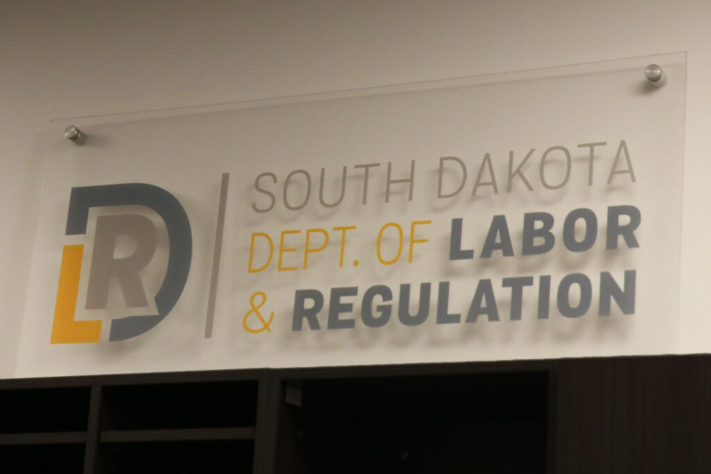 A sign for the South Dakota Department of Labor and Regulation at its Sioux Falls office in June 2025. (Makenzie Huber/South Dakota Searchlight)
