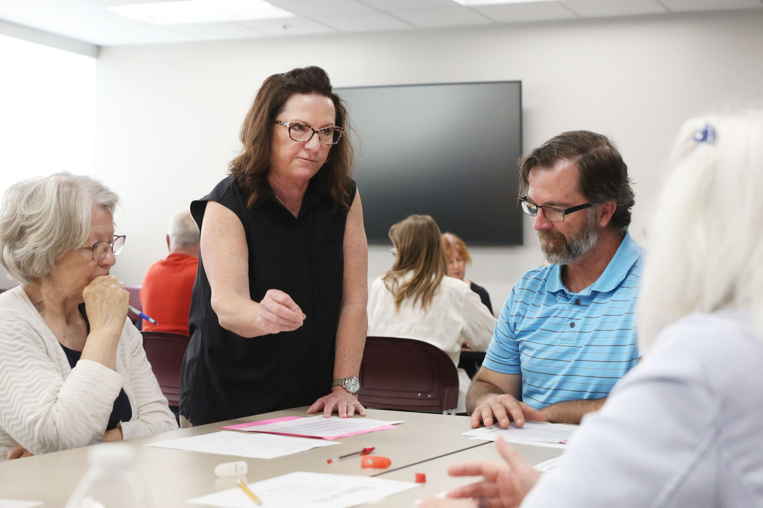 Minnehaha County Auditor Leah Anderson gives advice to post-election audit workers on June 25, 2024. The county recounted all ballots from the June primary, though state law calls for at least a 5% audit. (Makenzie Huber/South Dakota Searchlight)