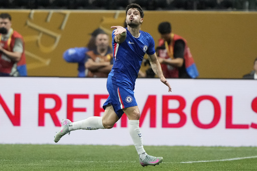 Chelsea's Pedro Neto blows a kiss as he celebrates after scoring the opening goal against Los Angeles FC during the Club World Cup group D soccer match between Chelsea and Los Angeles FC in Atlanta, Monday, June 16, 2025. (AP Photo/Brynn Anderson)