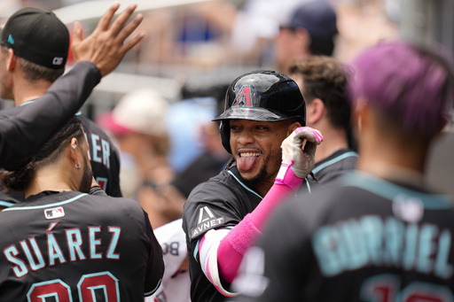 Arizona Diamondbacks second baseman Ketel Marte (4) celebrates his solo homer against the Atlanta Braves in the eighth inning of a baseball game, Thursday, June 5, 2025, in Atlanta. (AP Photo/Mike Stewart)