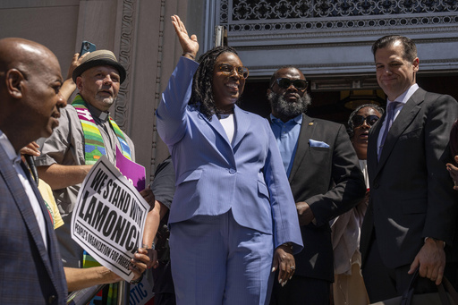 Rep. LaMonica Mclver (D-10th) waves at supporters as she exits a federal court Wednesday, June 25, 2025, in Newark, N.J. (AP Photo/Yuki Iwamura)