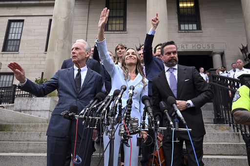 Karen Read, center, waves to supporters after she was found not guilty of second-degree murder on Wednesday, June 18, 2025, in Dedham, Mass. (AP Photo/Josh Reynolds)
