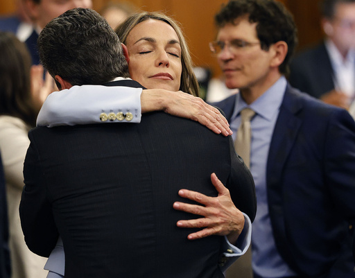 Karen Read hugs lawyer Alan Jackson after a not guilty verdict of second-degree murder is read in Norfolk Superior Court, Wednesday, June 18, 2025, in Dedham, Mass. (Greg Derr/The Patriot Ledger via AP, Pool)