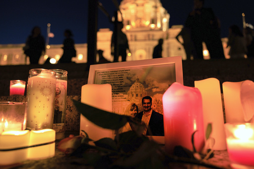 A candlelight vigil for former House Speaker Melissa Hortman and her husband Mark, who were fatally shot, at the state Capitol, Wednesday, June 18, 2025, in St. Paul, Minn. (AP Photo/Nikolas Liepins)
