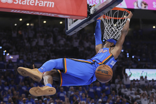 Oklahoma City Thunder guard Shai Gilgeous-Alexander (2) dunks during the second half of Game 5 of the Western Conference finals of the NBA basketball playoffs against the Minnesota Timberwolves, Wednesday, May 28, 2025, in Oklahoma City. (AP Photo/Nate Billings)