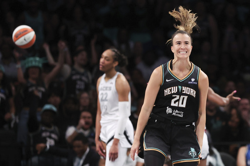 New York Liberty guard Sabrina Ionescu (20) reacts after drawing a foul and scoring during the second half of a WNBA basketball game against the Las Vegas Aces, Saturday, May 17, 2025, in New York. (AP Photo/Heather Khalifa)