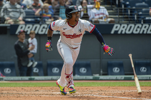Cleveland Guardians' Jose Ramirez watches his solo home run off Los Angeles Angels starting pitcher Jack Kochanowciz during the fourth inning of a baseball game, Sunday, June 1, 2025, in Cleveland. (AP Photo/Phil Long)