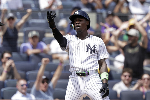 New York Yankees' Jazz Chisholm Jr. reacts after hitting a three-run scoring triple during the third inning of a baseball game against the Athletics, Sunday, June 29, 2025, in New York. (AP Photo/Adam Hunger)