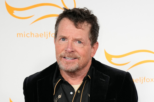 FILE - Michael J. Fox arrives at A Country Thing Happened On The Way To Cure Parkinson's in Nashville, Tenn., on April 26, 2023. (AP Photo/George Walker IV, File)
