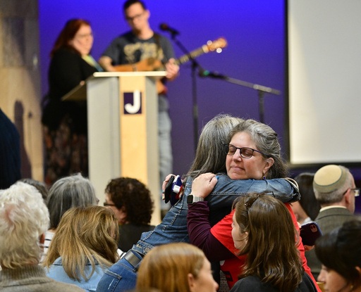Women embrace before a community vigil at the Boulder Jewish Community Center to mark an attack in Boulder, Colo., Wednesday, June 4, 2025. (Andy Cross/The Denver Post via AP, Pool)