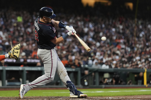 Atlanta Braves' Sean Murphy hits a sacrifice fly during the fourth inning of a baseball game against the San Francisco Giants, Friday, June 6, 2025, in San Francisco. (AP Photo/Godofredo A. Vásquez)