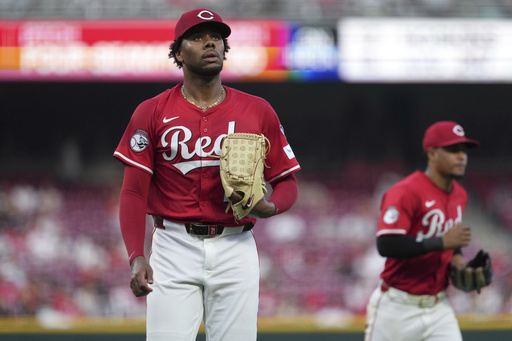 Cincinnati Reds' Hunter Greene walks to the dugout in the fifth inning of a baseball game against the Milwaukee Brewers, Tuesday, June 3, 2025, in Cincinnati. (AP Photo/Kareem Elgazzar)