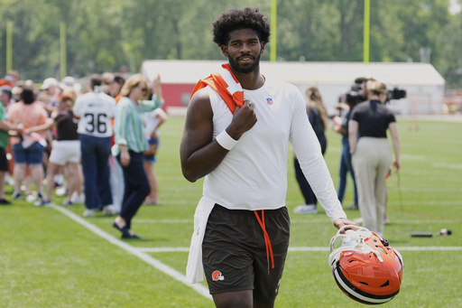 Cleveland Browns quarterback Shedeur Sanders walks off the field after an NFL football practice in Berea, Ohio, Wednesday, June 4, 2025. (AP Photo/Sue Ogrocki)
