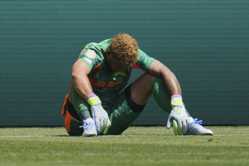 Mamelodi Sundowns' Ronwen Williams sits dejected after Borussia scored during the Club World Cup Group F soccer match between Mamelodi Sundowns and Borussia Dortmund in Cincinnati, Saturday, June 21, 2025. (AP Photo/Jeff Dean)
