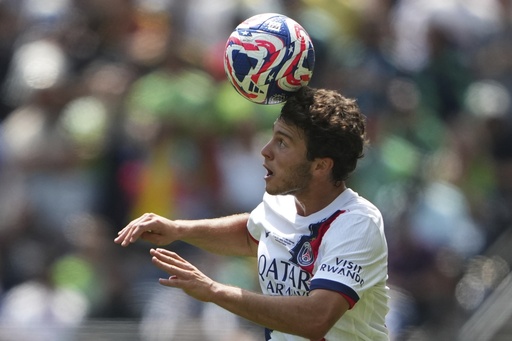 Paris Saint-Germain's Joao Neves heads the ball during the Club World Cup Group B soccer match between Seattle Sounders and PSG in Seattle, Monday, June 23, 2025. (AP Photo/Lindsey Wasson)