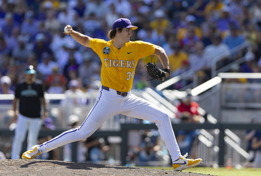 LSU's Chase Shores pitches against Coastal Carolina in the seventh inning of Game 2 of the NCAA College World Series baseball finals in Omaha, Neb., Sunday, June 22, 2025. (AP Photo/Rebecca S. Gratz)