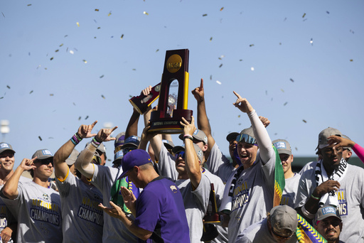 LSU's Jared Jones, center, hoists the championship trophy with his teammates following their 5-3 win over Coastal Carolina in Game 2 of the NCAA College World Series baseball finals in Omaha, Neb., Sunday, June 22, 2025. (AP Photo/Rebecca S. Gratz)