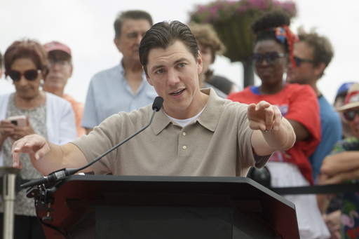 Washington Capitals forward T.J. Oshie speaks to the crowd at Washington Harbour to announce his retirement from the NHL, Monday, June 9, 2025, in Washington. (AP Photo/Rod Lamkey, Jr.)