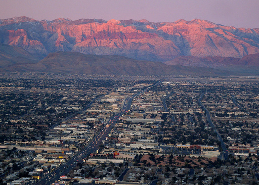 FILE - A view of the suburbs of Las Vegas from atop the Stratosphere tower looking west down Sahara Ave., towards the Spring Mountains, Feb. 9, 2005. (AP Photo/Joe Cavaretta, File)