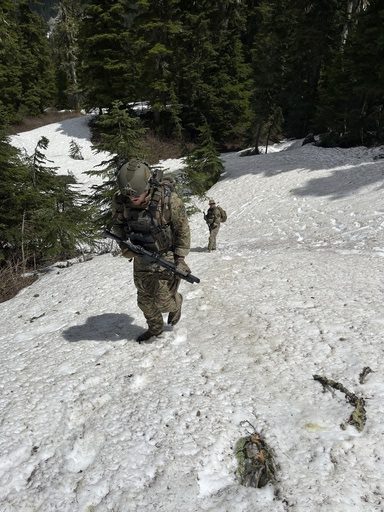 In this handout photo provided by the Snohomish County Sheriff's Office deputies participate in the search for Travis Decker, at an undisclosed location in Washington state, Friday, June 6, 2025. (Snohomish County Sheriff's Office photo via AP)