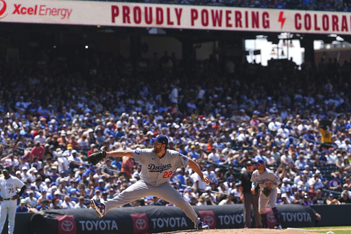 Los Angeles Dodgers starting pitcher Clayton Kershaw (22) works against the Colorado Rockies in the sixth inning of a baseball game Thursday, June 26, 2025, in Denver. (AP Photo/David Zalubowski)