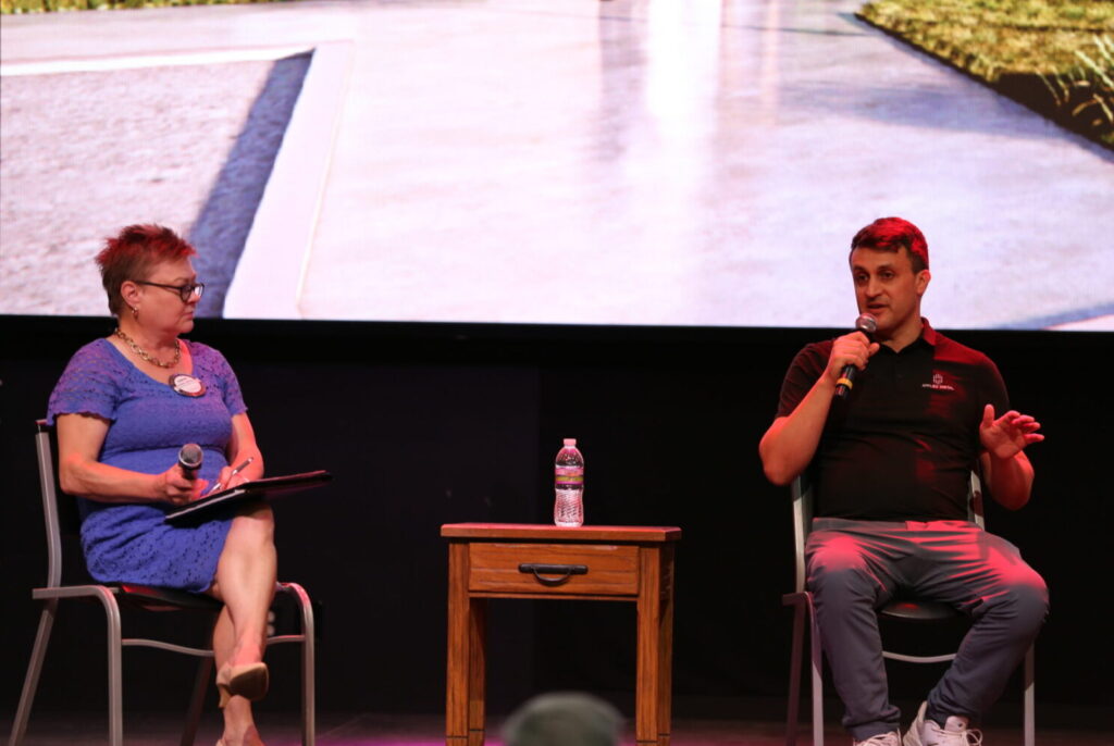 Sioux Falls Rotarian Kersten Johnson, left, moderates a panel discussion including Applied Digital's Nick Phillips on June 16, 2025, at the South Dakota Military Heritage Alliance in Sioux Falls. (Joshua Haiar/South Dakota Searchlight)