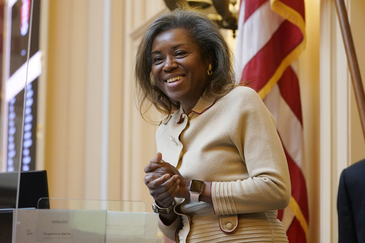FILE - Virginia Lt. Gov. Winsome Earle-Sears greets visitors prior to the start of the Senate Session at the Virginia Capitol, Jan. 25, 2022, in Richmond, Va. (AP Photo/Steve Helber, File)