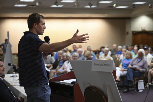 Conor Lamb speaks to the crowd at a town hall-style event organized by progressive groups at Central Penn College, Sunday, June 22, 2025, in Enola, Pa. (AP Photo/Marc Levy)