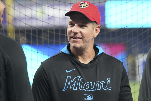 Miami Marlins manager Clayton McCullough wears a Florida Panthers cap before a baseball game against the San Francisco Giants, Friday, May 30, 2025, in Miami. (AP Photo/Lynne Sladky)