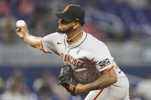 San Francisco Giants relief pitcher Camilo Doval throws during the ninth inning of a baseball game against the Miami Marlins, Sunday, June 1, 2025, in Miami. (AP Photo/Lynne Sladky)