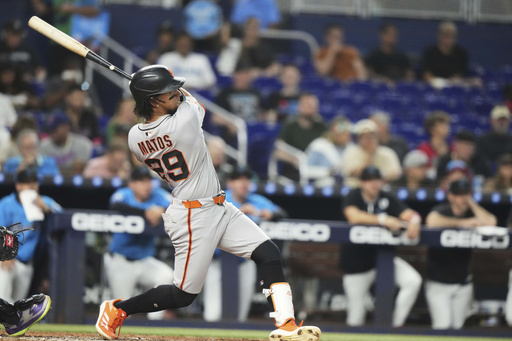 San Francisco Giants' Luis Matos hits a three-run home run during the fourth inning of a baseball game against the Miami Marlins, Sunday, June 1, 2025, in Miami. (AP Photo/Lynne Sladky)