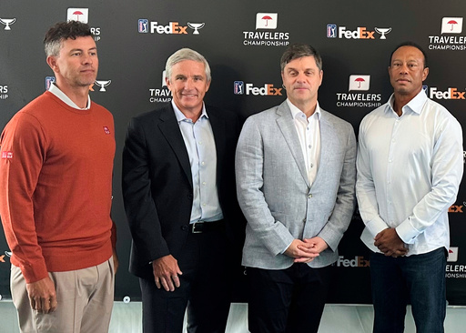 From left, Adam Scott, PGA Tour Commissioner Jay Monahan, incoming CEO Brian Rolapp, Tiger Woods at the Travelers Championship in Cromwell, Connecticut, Tuesday, June 17, 2025. (AP Photo/Doug Ferguson).