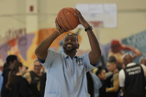 Ray Woodfork, a graduate of Twinning Project's collaboration with the NBA's Golden State Warriors and the California Department of Corrections and Rehabilitation's cohort 1, shoots a basket at Solano State Prison in Vacaville, Calif., Tuesday, Feb. 11, 2025. (AP Photo/Jeff Chiu)
