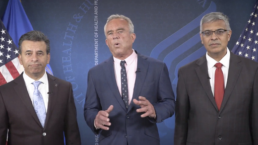 This image from video provided by the Department of Health and Human Services shows Health and Human Services Secretary Robert F. Kennedy Jr. speaking alongside Food and Drug Administration administrator Dr. Martin Makary, left, and Dr. Jay Bhattacharya, director of the National Institutes of Health, as they announce that the government would no longer endorse the COVID-19 vaccine for healthy children or pregnant women. (Health and Human Services via AP)