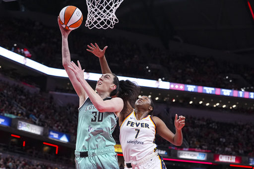 New York Liberty forward Breanna Stewart (30) shoots in front of Indiana Fever forward Aliyah Boston (7) in the first half of a WNBA basketball game in Indianapolis, Saturday, May 24, 2025. (AP Photo/Michael Conroy)