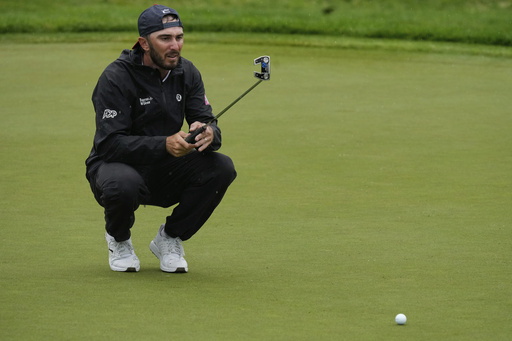 Max Homa lines up his putt on the 13th green during the second round of the Memorial golf tournament, Friday, May 30, 2025, in Dublin, Ohio. (AP Photo/Sue Ogrocki)