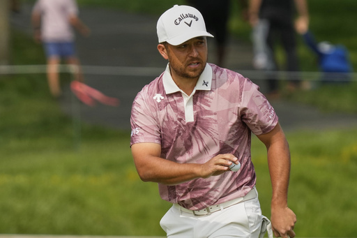 Xander Schauffele gestures after his putt on the ninth green during the third round of the Memorial golf tournament Saturday, May 31, 2025, in Dublin, Ohio. (AP Photo/Sue Ogrocki)