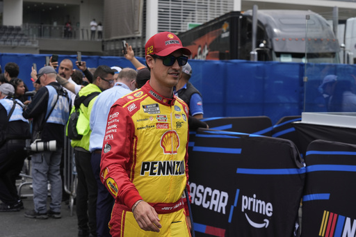 Joey Logano walks to his car before a NASCAR Cup Series auto race at Hermanos Rodríguez race track in Mexico City, Sunday, June 15, 2025. (AP Photo/Fernando Llano)