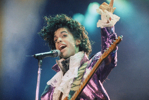 FILE - Prince performs at the Forum in Inglewood, Calif., on Feb. 18, 1985. (AP Photo/Liu Heung Shing, File)
