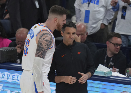 Oklahoma City Thunder center Isaiah Hartenstein (55) talks with head coach Mark Daigneault during the second half of Game 1 of the NBA Finals basketball series against the Indiana Pacers Thursday, June 5, 2025, in Oklahoma City. (AP Photo/Nate Billings)