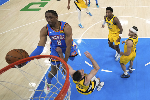 Oklahoma City Thunder forward Jalen Williams (8) shoots against Indiana Pacers guard T.J. McConnell (9) during the first half of Game 2 of the NBA Finals basketball series Sunday, June 8, 2025, in Oklahoma City. (Matthew Stockman/Pool Photo via AP)