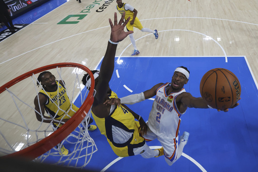 Oklahoma City Thunder guard Shai Gilgeous-Alexander (2) shoots around Indiana Pacers forward Pascal Siakam during the second half of Game 5 of the NBA Finals basketball series, Monday, June 16, 2025, in Indianapolis. (Matthew Stockman/Pool Photo via AP)