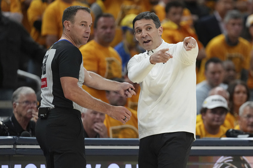 Oklahoma City Thunder head coach Mark Daigneault argues a call with the referee during the second half of Game 4 of the NBA Finals basketball series against the Indiana Pacers, Friday, June 13, 2025, in Indianapolis. (AP Photo/Michael Conroy)