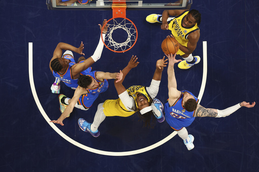 Indiana Pacers center Myles Turner (33) drives to the basket against Oklahoma City Thunder forward Chet Holmgren (7) during the first half of Game 6 of the NBA Finals basketball series, Thursday, June 19, 2025, in Indianapolis. (Maddie Meyer/Pool Photo via AP)