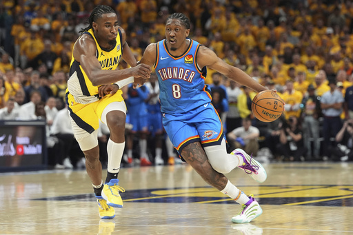 Oklahoma City Thunder forward Jalen Williams (8) drives as Indiana Pacers forward Aaron Nesmith defends during the second half of Game 4 of the NBA Finals basketball series, Friday, June 13, 2025, in Indianapolis. (AP Photo/Michael Conroy)
