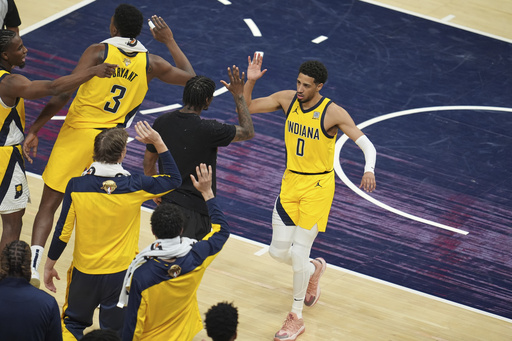Indiana Pacers guard Tyrese Haliburton (0) celebrates after making a basket against the Oklahoma City Thunder during the second half of Game 3 of the NBA Finals basketball series, Wednesday, June 11, 2025, in Indianapolis. (AP Photo/Michael Conroy)