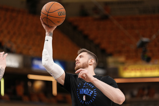 Oklahoma City Thunder center Isaiah Hartenstein warms up prior to Game 4 of the NBA Finals basketball series against the Indiana Pacers, Friday, June 13, 2025, in Indianapolis. (AP Photo/Abbie Parr)