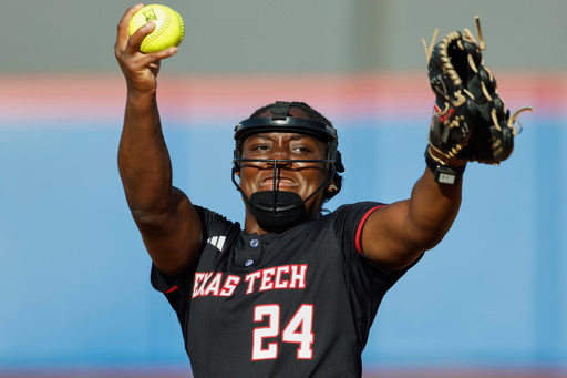 FILE - Texas Tech pitcher NiJaree Canady (24) throws during an NCAA college softball game on Friday, March 28, 2025, in Lawrence, Kan. (AP Photo/Colin E Braley, File)