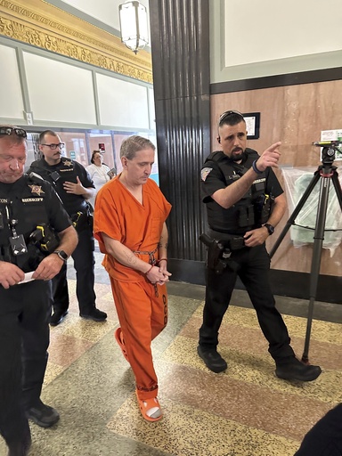 Oklahoma County Sheriff's deputies lead longtime death row inmate Richard Glossip to a courtroom on Monday, June 9, 2025, at the Oklahoma County Courthouse in Oklahoma City. (AP Photo/Sean Murphy)